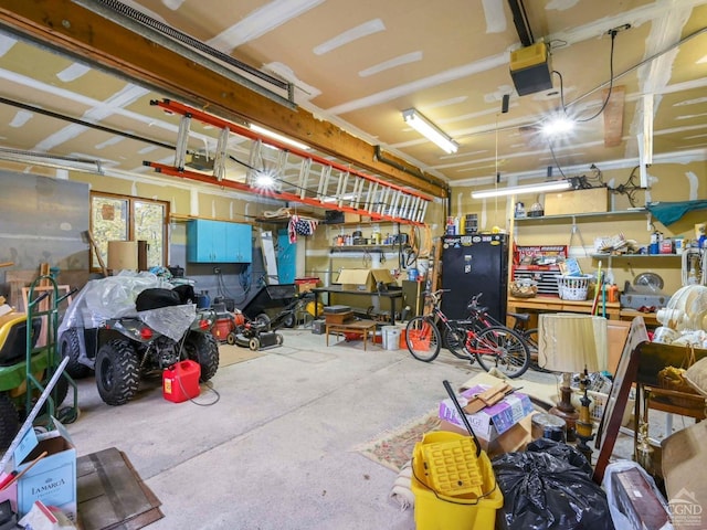 garage featuring a workshop area and a garage door opener