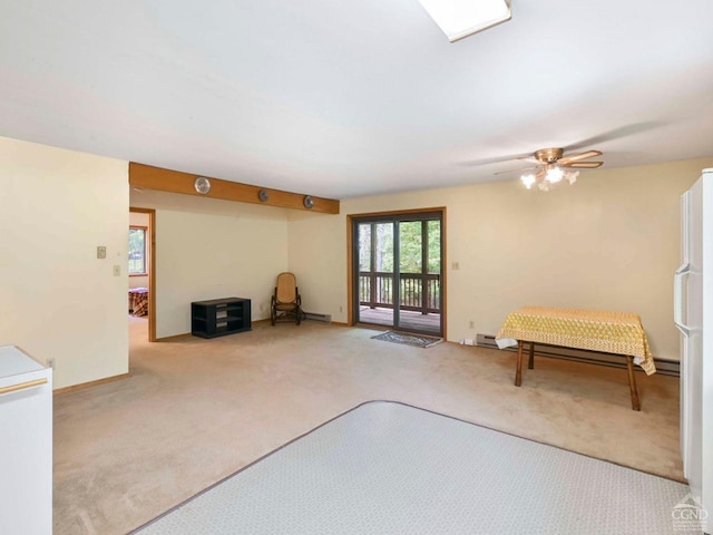 interior space with light carpet and ceiling fan