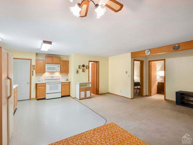 kitchen with white appliances, light colored carpet, and ceiling fan