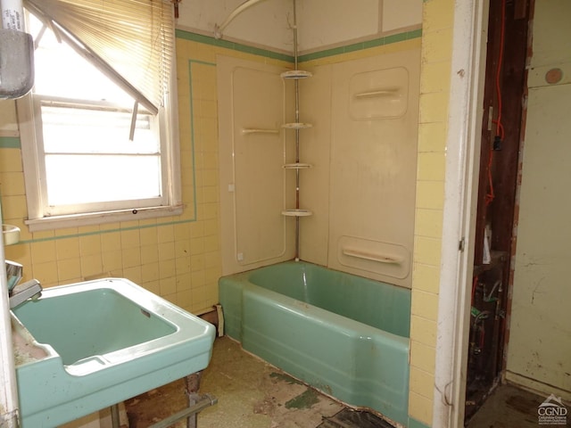 full bath featuring bathing tub / shower combination and a sink