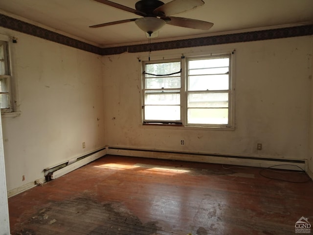spare room with hardwood / wood-style flooring and ceiling fan