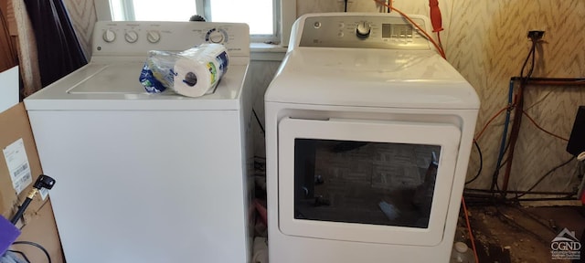 laundry room featuring independent washer and dryer and laundry area