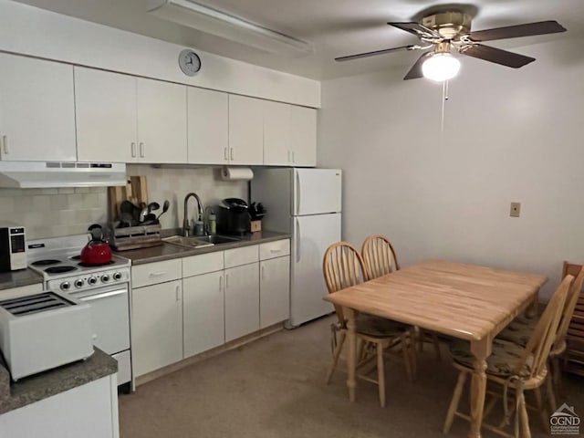 kitchen with white cabinetry, sink, ceiling fan, backsplash, and white appliances