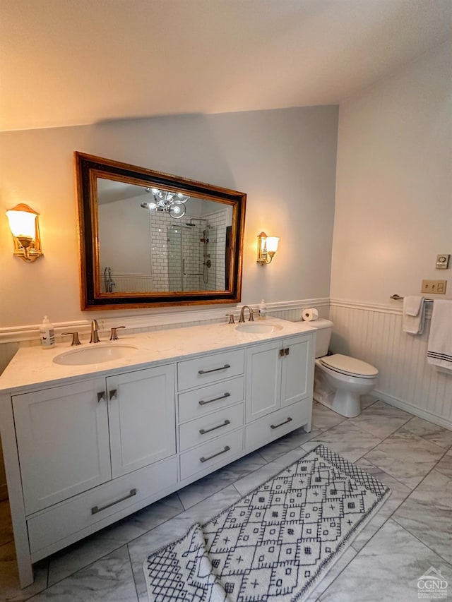 bathroom featuring vanity, an enclosed shower, and toilet