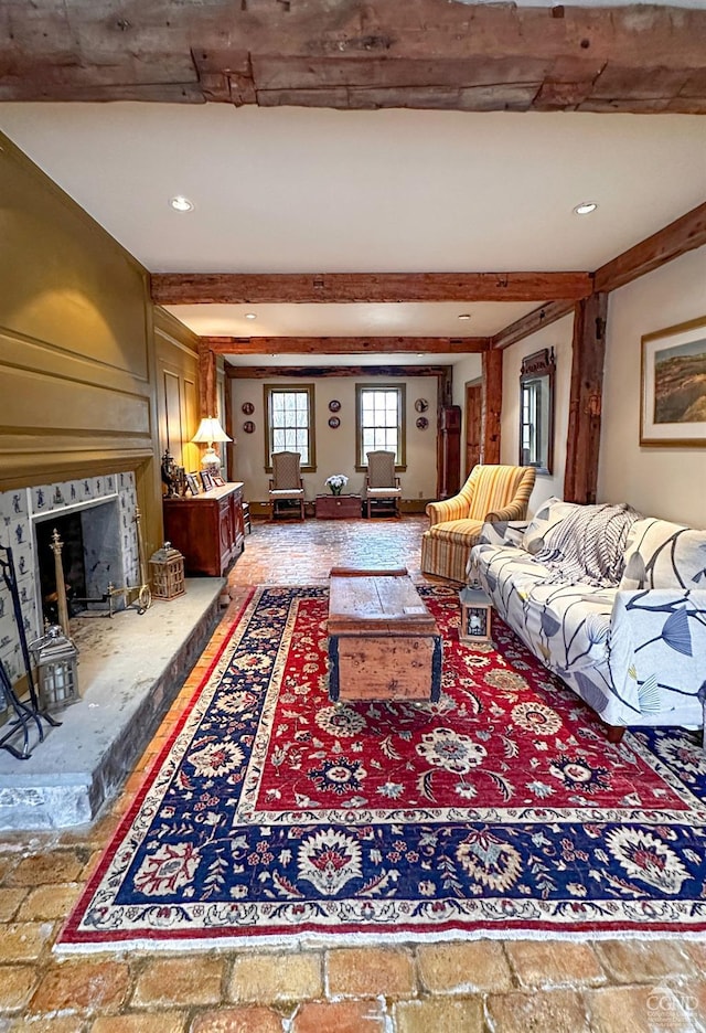 living room with beam ceiling