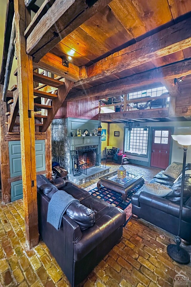 unfurnished living room featuring wood walls