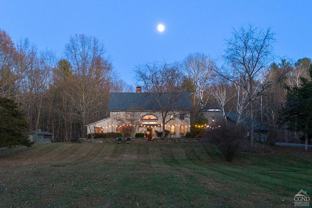 view of front of home with a lawn