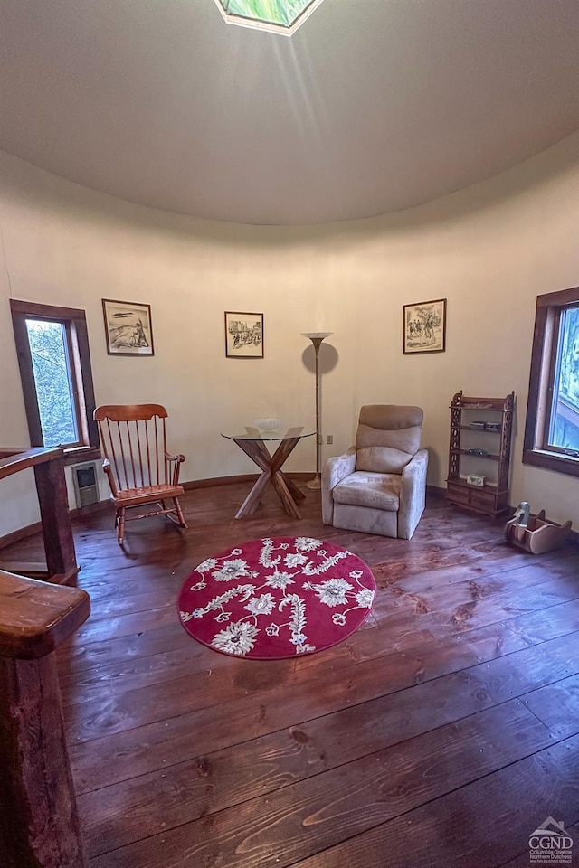 living area with hardwood / wood-style floors