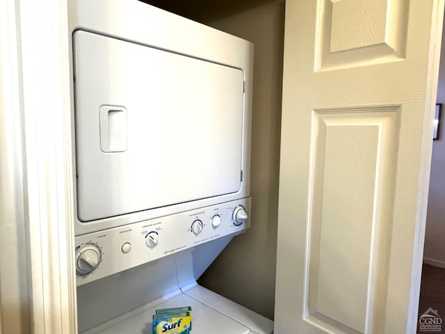 laundry room featuring stacked washer / dryer