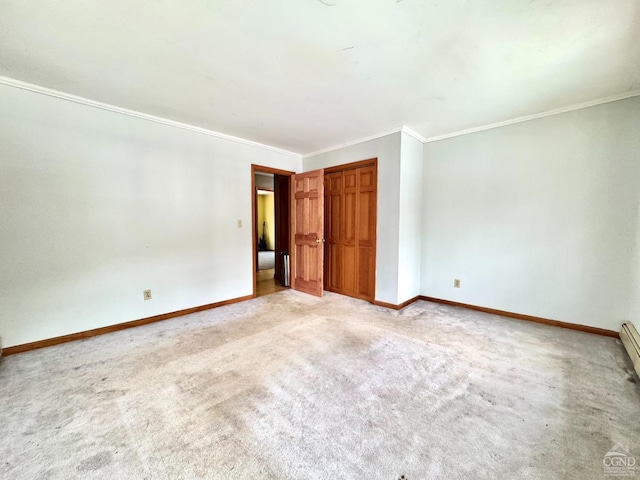 empty room featuring light carpet and crown molding