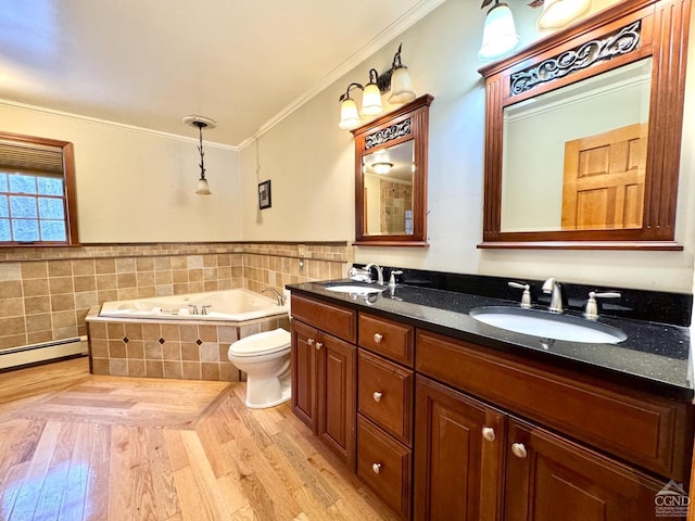 bathroom with toilet, hardwood / wood-style flooring, a relaxing tiled tub, ornamental molding, and vanity