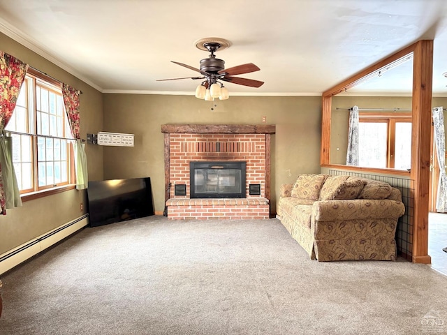 living room featuring carpet, crown molding, a fireplace, and a baseboard radiator