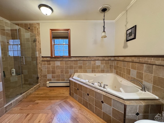 bathroom featuring hardwood / wood-style flooring, a baseboard radiator, independent shower and bath, tile walls, and ornamental molding