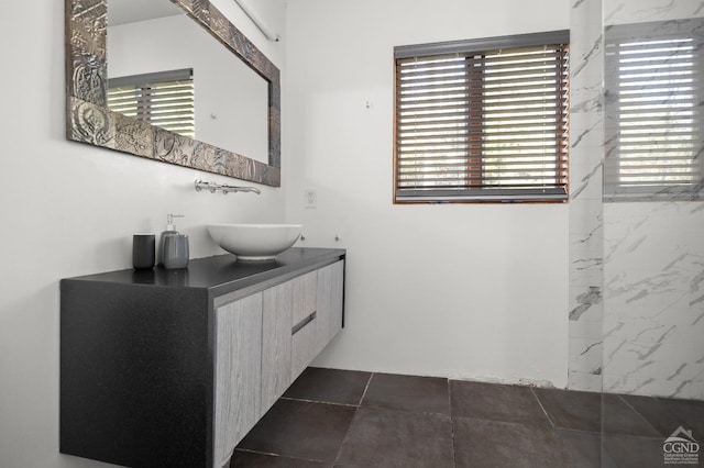 bathroom featuring tile patterned flooring and vanity