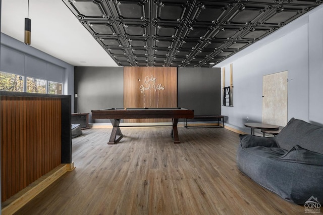 recreation room with hardwood / wood-style floors and billiards