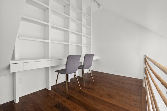 office space with rail lighting and dark wood-type flooring