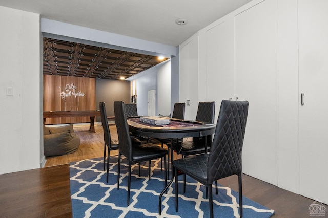 dining room with dark wood-type flooring