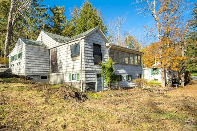 view of home's exterior featuring a sunroom