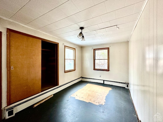 unfurnished bedroom with wooden walls