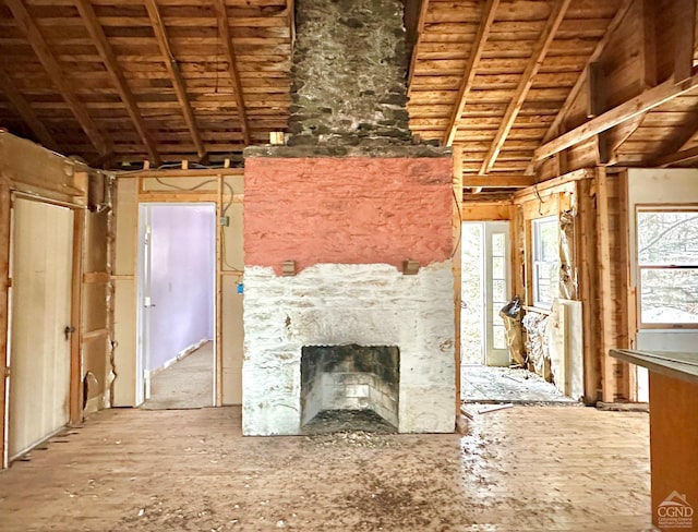 unfurnished living room with a fireplace and vaulted ceiling