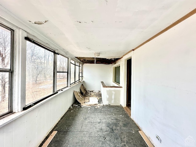 unfurnished sunroom featuring a healthy amount of sunlight