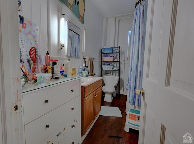 bathroom featuring hardwood / wood-style flooring, vanity, and toilet