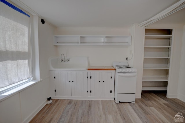 interior space with light hardwood / wood-style flooring and sink