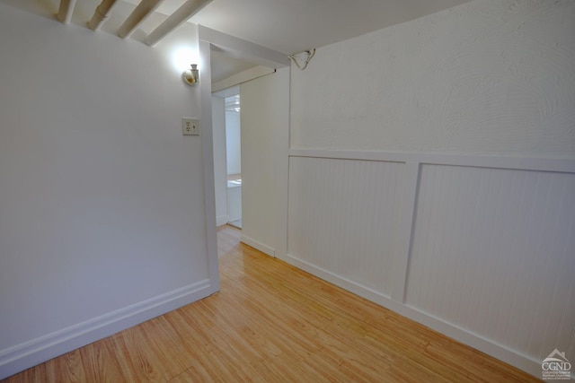 empty room featuring hardwood / wood-style flooring