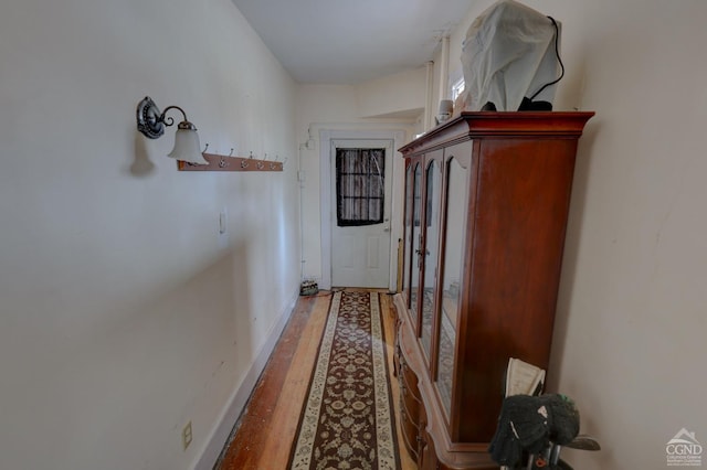 hallway featuring hardwood / wood-style floors