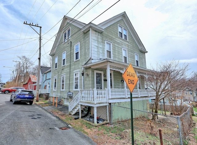 townhome / multi-family property with a porch