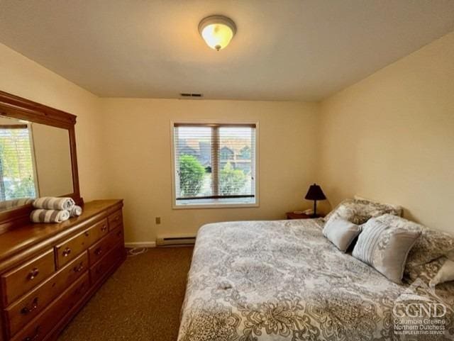 bedroom featuring a baseboard radiator and dark carpet