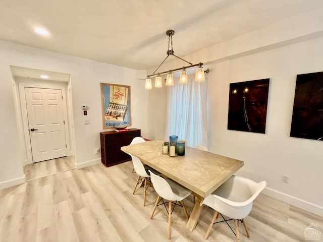 dining room with light wood-type flooring