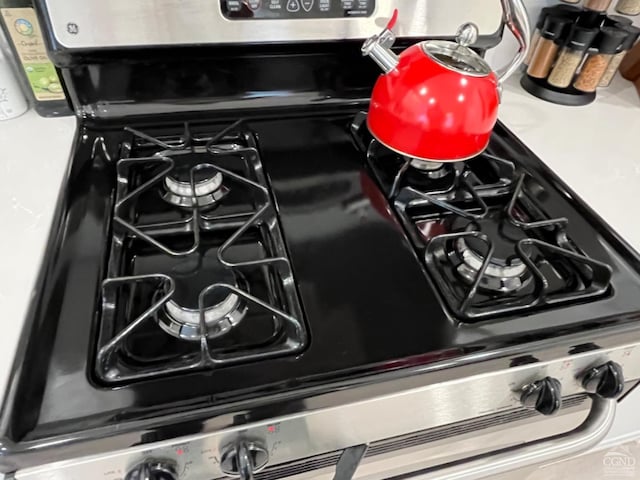 interior details featuring black gas range oven