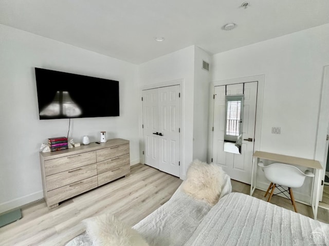 bedroom featuring light wood-type flooring