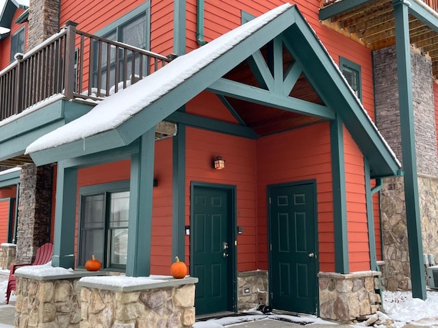 property entrance with a balcony