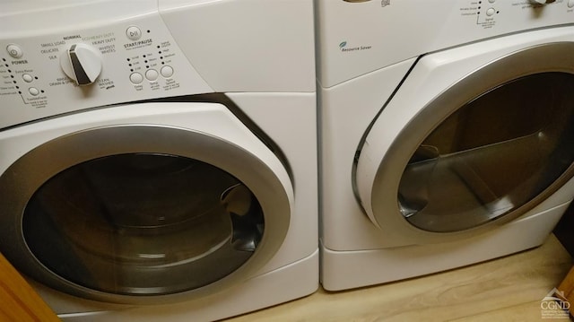 washroom with independent washer and dryer