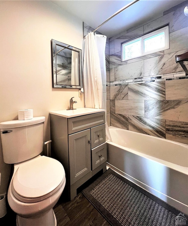 full bathroom featuring shower / bath combination with curtain, vanity, toilet, and hardwood / wood-style flooring