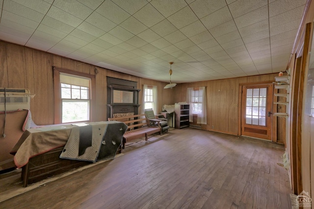 miscellaneous room with wooden walls and hardwood / wood-style floors