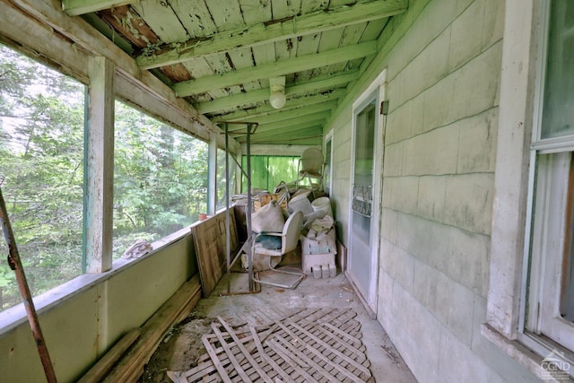 sunroom featuring lofted ceiling