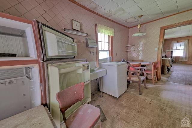 laundry room featuring crown molding