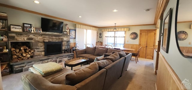 carpeted living room with recessed lighting, a fireplace, wainscoting, and ornamental molding