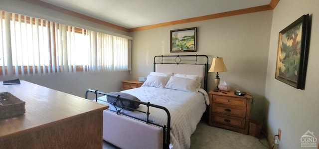 bedroom with carpet and ornamental molding