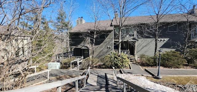 rear view of house with a chimney