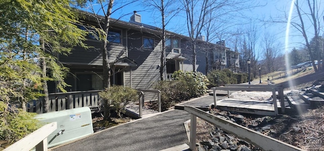 view of side of home with a chimney