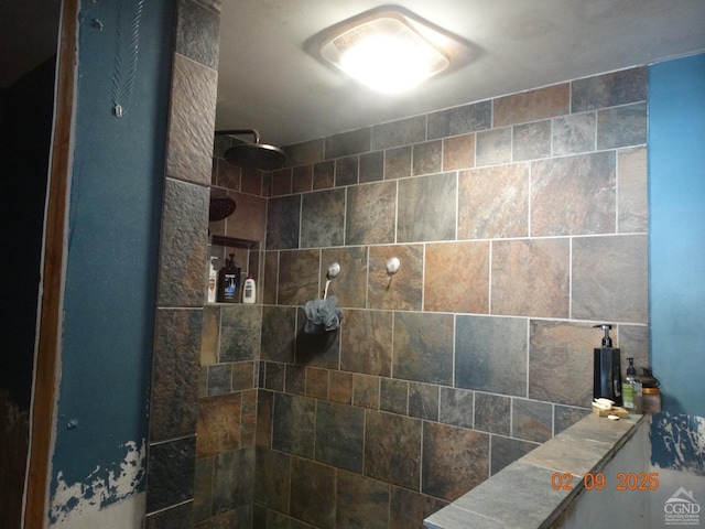 bathroom with a tile shower