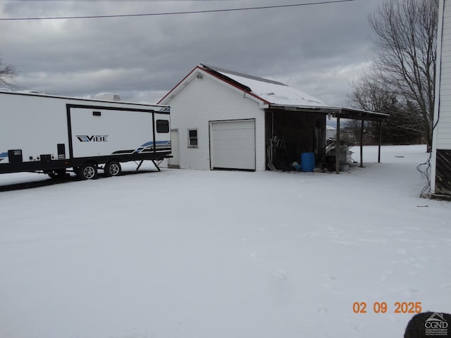 view of snow covered garage