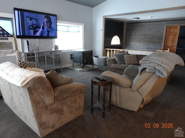 carpeted living room featuring vaulted ceiling