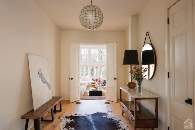 entryway with light wood finished floors