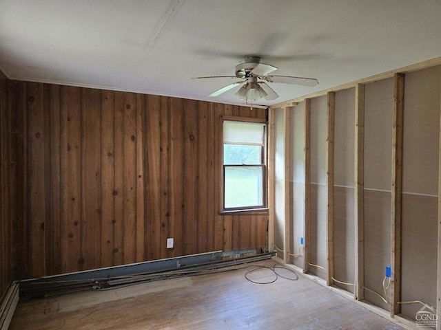 spare room with hardwood / wood-style floors and ceiling fan