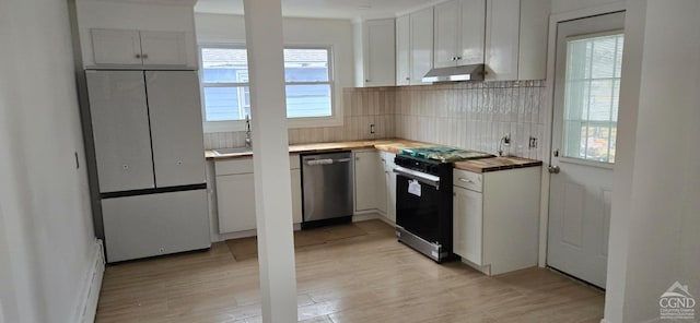 kitchen with backsplash, black gas stove, wood counters, dishwasher, and under cabinet range hood